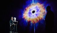 In this picture taken on March 24, 2017, renowned physicist Stephen Hawking, 75, speaks to an audience by hologram (L) in Hong Kong, beamed live from his office in Cambridge, England. AFP / Anthony WALLACE
