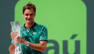 Roger Federer of Switzerland holds the Butch Buchholz trophy after his match against Rafael Nadal of Spain (not pictured) in the men's singles championship of the 2017 Miami Open at Crandon Park Tennis Center. Federer won 6-3, 6-4. Geoff Burke
