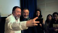 Ai Weiwei taking a selfie with fans and Uli Sigg, a Swiss businessman, diplomat and art collector, at the Museum of Islamic Art. Pic: Baher Amin / The Peninsula