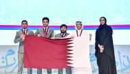 H E Sheikha Hind bint Hamad Al Thani with the Qatar University Team for boys who won the first place at fourth International Universities Arabic Debating Championship 2017 in Doha, yesterday. 