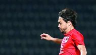 Al Rayyan skipper Rodrigo Tabata (tries to kick past the Al Khor goalkeeper during their QSL match.