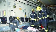 Rescue workers attending to a patient during the drill. Emiri Air Force and medical personnel who participated in the military exercise.