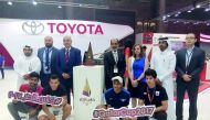 Officials and others with Qatar Cup Trophy at the booth.