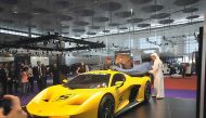 Retired Formula One star Emerson Fittipaldi's new EF7 super car being unveiled at the Qatar Motor Show. 