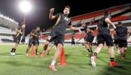 Lekhwiya players in action during a practice session on the eve of their AFC Champions League match against UAE's Al Jazira. INSET: TOP - Lekhwiya coach Djamel Belmadi sepaks to media during a press conference held yesterday.