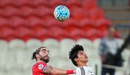 Lekhwiya's Spanish defender Chico Flores (left) locked in an areal battle for supremacy with Al Jazira's Emirati forward Ahmed Al Attas during their AFC Champions League Group B match played at the Mohammed Bin Zayed Stadiun in Abu Dhabi yesterday.