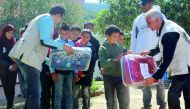 Children receiving blankets and other winter clothings in Tunisia.