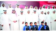 Qatar's Minister of Culture and Sports H E Salah bin Ghanem Al Thani and Qatar Football Association (QFA) President Sheikh Hamad bin Khalifa bin Ahmed Al Thani pose with former Qatari footballers at Qatar's Players' Association (QPA) ceremony on Monday in