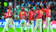 Kings XI Punjab bowler Sandeep Sharma (centre) celebrates with his team-mates the dismissal of Royal Challengers Bangalore batsman AB de Villiers during the IPL Twenty20 match at the M. Chinnaswamy Stadium in Bangalore