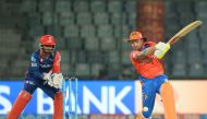 Gujarat Lions batsman Brendom McCullum (R) is watched by Delhi Daredevils wicketkeeper Rishabh Pant as he plays a shot during the 2017 Indian Premier League (IPL) Twenty20 cricket match between Delhi Daredevils and Gujarat Lions at The Feroz Shah Kotla Cr