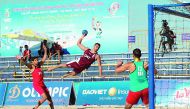 A Qatari beach handball player leaps to score in this file photo. Qatar will be looking to defend their Asian Beach Handball Championship title at the Thai city of Pattaya. 

