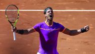 Rafael Nadal of Spain celebrates his victory over Novak Djokovic of Serbia after their Madrid Open semi-final in Madrid.