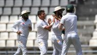 Pakistani bowler Yasir Shah (second left) celebrates with team-mates after taking the wicket of West Indies batsman Kraigg Brathwaite on the fifth day's play of the final Test match at the Windsor Park Stadium in Roseau, Dominica.