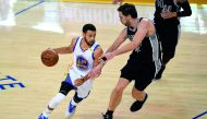 Stephen Curry (30) of the Golden State Warriors drives with the ball against Pau Gasol of the San Antonio Spurs during Game Two of the NBA Western Conference Finals at Oracle Arena in Oakland, California on Tuesday.