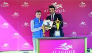 Sheikh Joaan bin Hamad Al Thani, President of Qatar Olympic Committee, presenting the trophies to the winners of the main race, Al Shaqab Locking Stakes (Gr1), of the race meeting held at Newbury on Saturday.