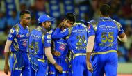 Jasprit Bumrah (centre) of Mumbai Indians celebrates with team-mates after the dismissal of unseen Rising Pune Supergiant batsman Rahul Tripathi during the IPL Twenty20 final match against Rising Pune Supergiant at The Rajiv Gandhi International Cricket S