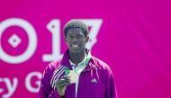 Mubarak Shannan of Qatar, shows off his bronze he won in tennis at the Islamic Solidarity Games in Baku yesterday. Qatar finished with 12 medals at the 11-day event.