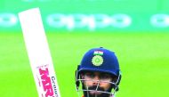 India's captain Virat Kohli celebrates his half century during the ICC Champions Trophy warm-up match against New Zealand at the Oval in London, yesterday.