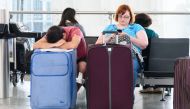 British Airways passenger sleep and sit inside Heathrow airport Terminal 5 waiting check in for their flights in London, England on May 29, 2017. Hundreds of thousands of flights were cancelled after the airline announced an IT computer crash. ( Ray Tang 