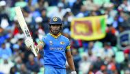 Sri Lanka's Danushka Gunathilaka acknowledges the crowd after reaching 50 runs during the ICC Champions Trophy match against India at the Oval in London on Thursday.