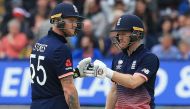 England's Eoin Morgan (R) and England's Ben Stokes (L) touch gloves during the ICC Champions Trophy match between England and Australia at Edgbaston in Birmingham, central England on June 10, 2017. Australia made 277 for 9 off their 50 overs.(AFP / Lindse
