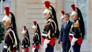 French President Emmanuel Macron waits for guests to leave at the Elysee Palace in Paris, France, June 12, 2017. REUTERS/Philippe Wojazer
