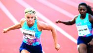 Netherlands' Dafne Schippers (left) crosses the finishing line ahead of Ivory Coast's Murielle Ahoure to win the women's 200m.