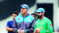 Pakistan's Mohammad Hafeez talks with head coach Mickey Arthur during nets.