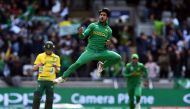 This file photo taken on June 7, 2017 shows Pakistan's Hasan Ali celebrating taking the wicket of South Africa's Wayne Parnell for 0 runs during the ICC Champions trophy match between Pakistan and South Africa at Edgbaston in Birmingham.(AFP / PAUL ELLIS)