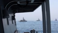 Military ships are seen during a joint naval exercise by US and Qatari troops in the Arabian Gulf, Qatar, June 16, 2017. REUTERS/Naseem Zeitoon