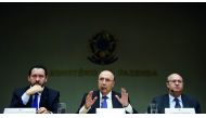 Brazilian Finance Minister Henrique Meirelles (centre), Planning Minister Dyogo Oliveira (left) and Central Bank of Brazil President Ilan Goldfajn addressing the press in Brasilia, Brazil, yesterday. The National Monetary Council announced after a meeting