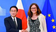EU Commissioner of Trade Cecilia Malmstrom (right) with Japan Foreign minister Fumio Kishida before their meeting at the EU Headquarters in Brussels yesterday.