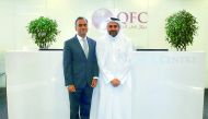 Yousuf Mohamed Al Jaida, Qatar Financial Centre Chief Executive Officer, and UK's Ambassador to Qatar, Ajay Sharma. at QFC headquarters. 