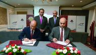 Minister of Transport and Communications, H E Jassim Saif Ahmed Al Sulaiti (standing right), who is also the Chairman of Mwani Qatar, witnessing the signing ceremony, between Mwani Qatar and Malaysian shipbuilding companies, in Kuala Lumpur, yesterday. 
