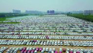 New cars in a parking lot of the Brilliance factory in Shenyang, in China’s northeast Liaoning province, yesterday. China posted better-than-expected growth in the second quarter, official data showed, but authorities warned that the world’s second larges