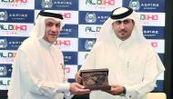 Bader Al Hay, Director of Education and Student Affairs of Aspire Academy, presents a gift to Hamad bin Rashid Al Naimi, Chairman of ALDOHA Link for IT during the signing ceremony at Aspire Academy yesterday. Pic: Baher Amin/ The Peninsula