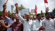 Air India employees hold placards as they shout slogans during a protest against the proposed privatisation of Air India by the government, in New Delhi, India July 18, 2017. (REUTERS/Adnan Abidi)