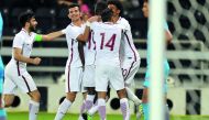 Qatari players celebrate after scoring their wining goal during the AFC U-23 Championship qualifying match against India at Al Sadd Stadium on Friday. Qatar coach Felix Sanchez reacts during a training session in this file photo.