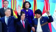 FROM LEFT (front row): Argentina’s President Mauricio Macri, Paraguay’s President Horacio Cartes and Bolivia’s President Evo Morales gesture alongside Ecuador’s head of the delegation Diego Rivadeneira Espinoza and Mexico’s Ambassador in Argentina Mabel G