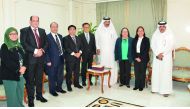 Mohammed bin Ahmed bin Towar Al Kuwari (fourth right), Vice Chairman, QC and Hans Leo Cacdac (centre), Administrator, OWWA, with other officials  during the meeting at Qatar Chamber