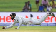 Indian cricket team captain Virat Kohli catches a ball during the second day of the first Test match between Sri Lanka and India at Galle International Cricket Stadium in Galle on July 27, 2017. / AFP / ISHARA S. KODIKARA