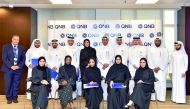 QNB officials with the induction programme participants.