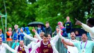 Qatari beach handball players celebrate after scoring against Hungary in the bronze medal match of the 10th World Games in Wroclaw, Poland yesterday. 