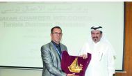 Mohamed bin Ahmed bin Tawar Al Kuwari, QC vice-president, honouring the head of the Tunisian trade delegation at QC headquarters, yesterday. 