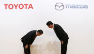 Toyota Motor President Akio Toyoda and Mazda Motor President Masamichi Kogai bow at a joint news conference in Tokyo, Japan August 4, 2017. REUTERS/Kim Kyung-Hoon