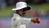 India's Ravindra Jadeja shows a ball as he gestures at fans. REUTERS/Dinuka Liyanawatte