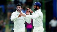 India’s Ravindra Jadeja celebrates with his team-mate Cheteshwar Pujara after taking the wicket of Sri Lanka’s Dhananjaya de Silva (not pictured).