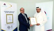 Mohammed Al Maadeed, Chief Support Services Officer of Mwani Qatar, receiving the certificate. 