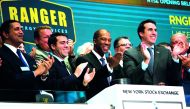 arron M. Anderson (C), president and chief executive officer of Ranger Energy Services, applauds after ringing the opening bell to celebrate his company's initial public offering (IPO) at the New York Stock Exchange (NYSE), August 11, 2017 in New York Cit