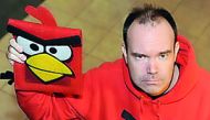 Chief Marketing Officer and Co-founder of Rovio Entertainment Oy, Peter Vesterbacka, dressed in a red ‘Angry Birds’ sweater poses with an ‘Angry Birds’ iPad case, in this file photo. 